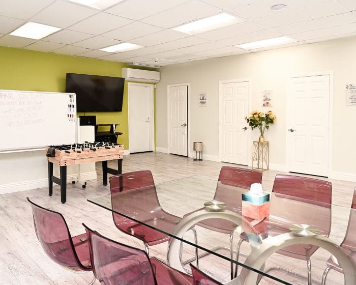 Partial Hospitalization Program In Los Angeles A Meeting Room With A Table, Chairs, And A Whiteboard For Discussions